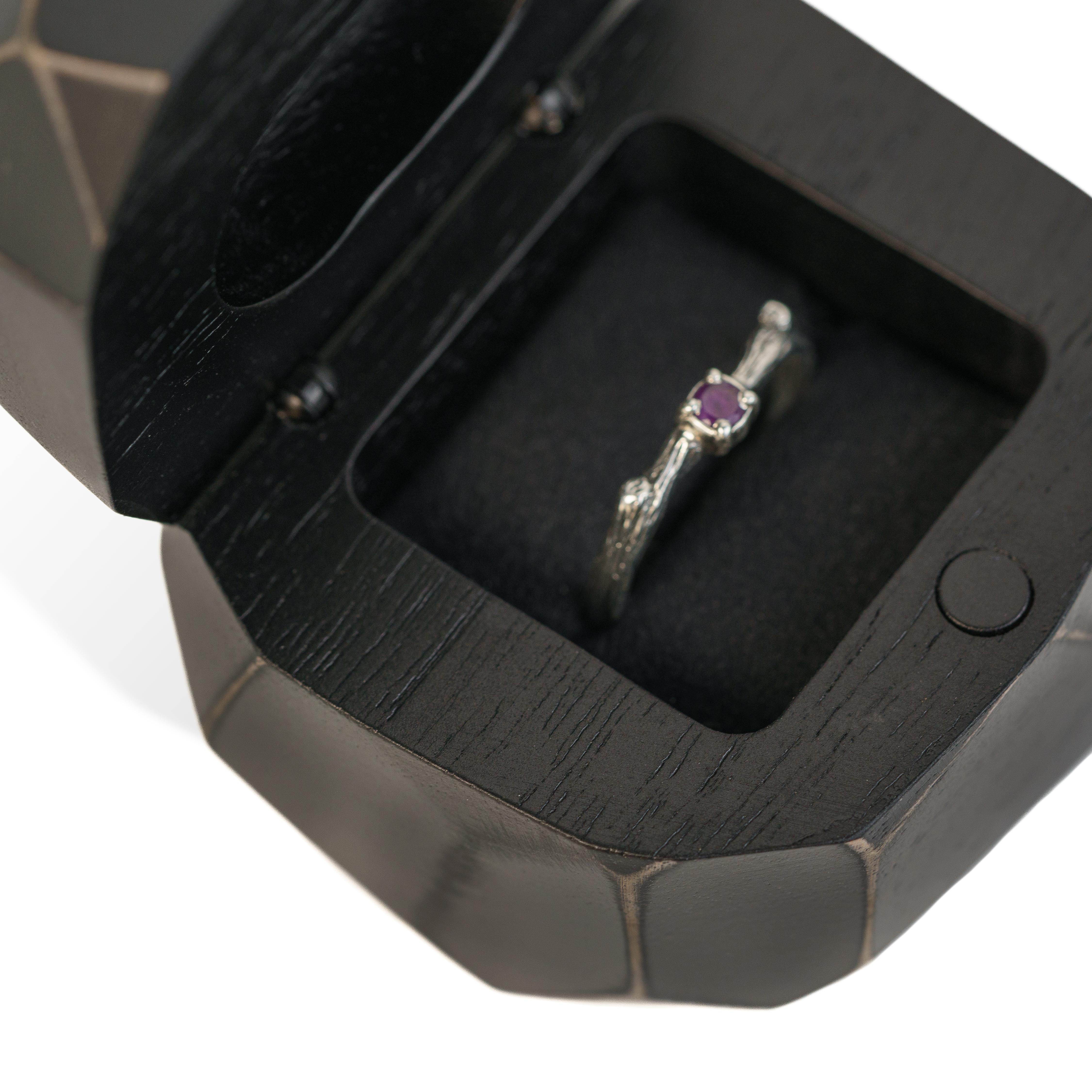 Close-up of the interior of the black epoxy and bog oak wood proposal ring box with ring compartment