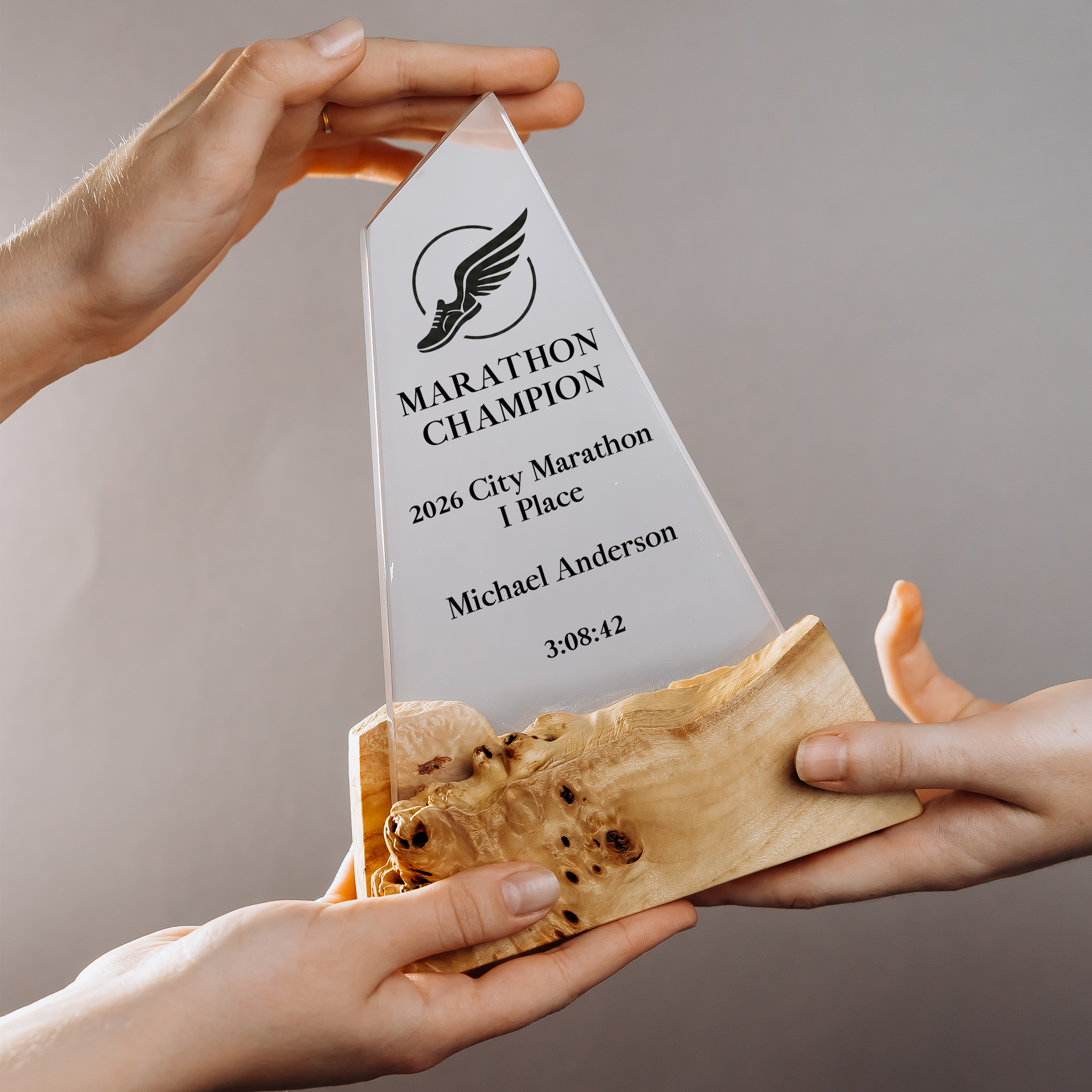 Clear epoxy award plaque engraved as a marathon champion trophy with runner name, place and finish time