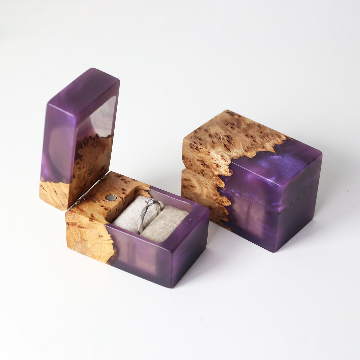Solitaire ring in the open purple and elm burl CHORD box, closed box beside it on white