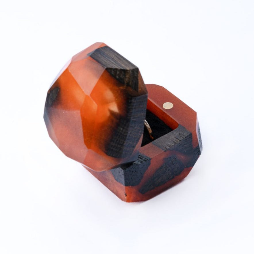 Angled view of the open amber epoxy and bog oak wood proposal ring box showing the interior compartment
