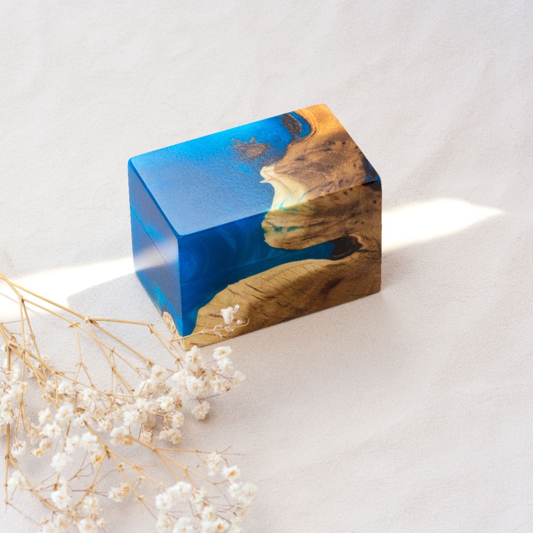 Closed engagement ring box crafted from blue epoxy and natural elm wood, CHORD design