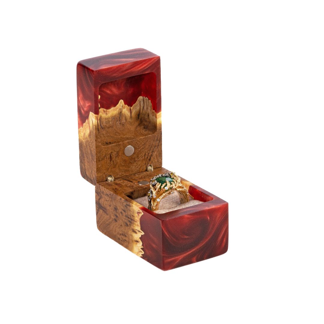 Front view of the open ruby epoxy and elm wood engagement ring box with the ring compartment visible