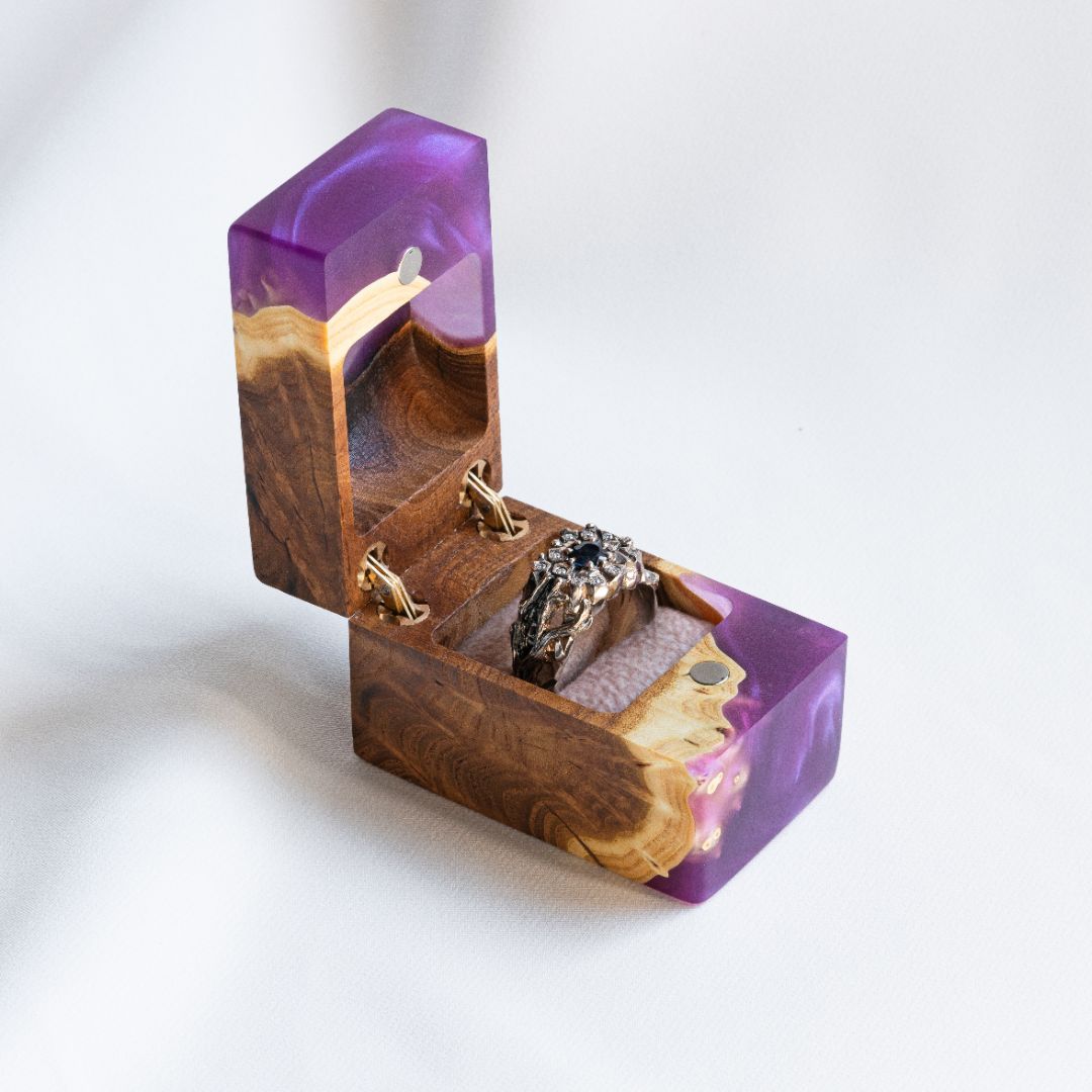 Luxury purple epoxy and elm wood engagement ring box displayed open from a front angle