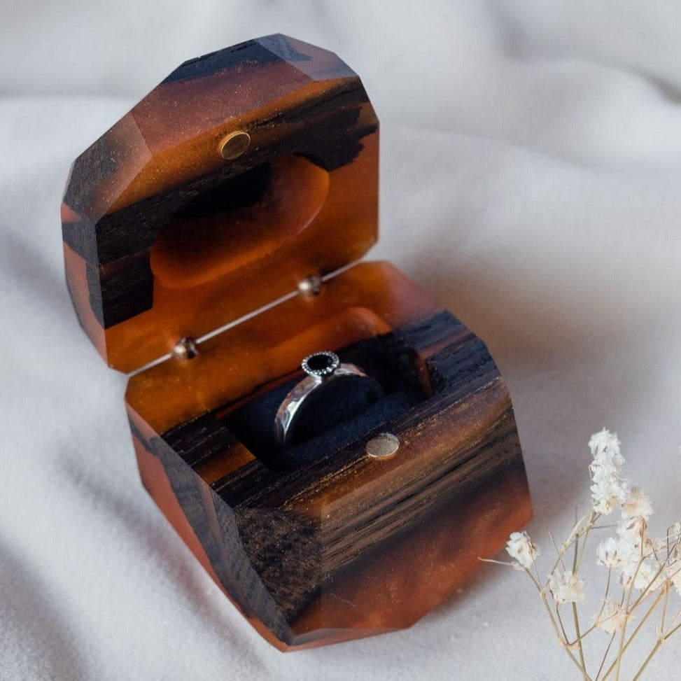 Luxury amber epoxy and bog oak wood proposal ring box shown open from a close front angle