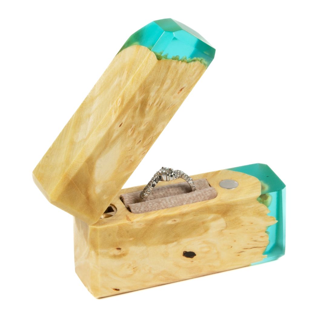 Premium aqua blue epoxy and maple wood proposal ring box shown open with the ring compartment visible