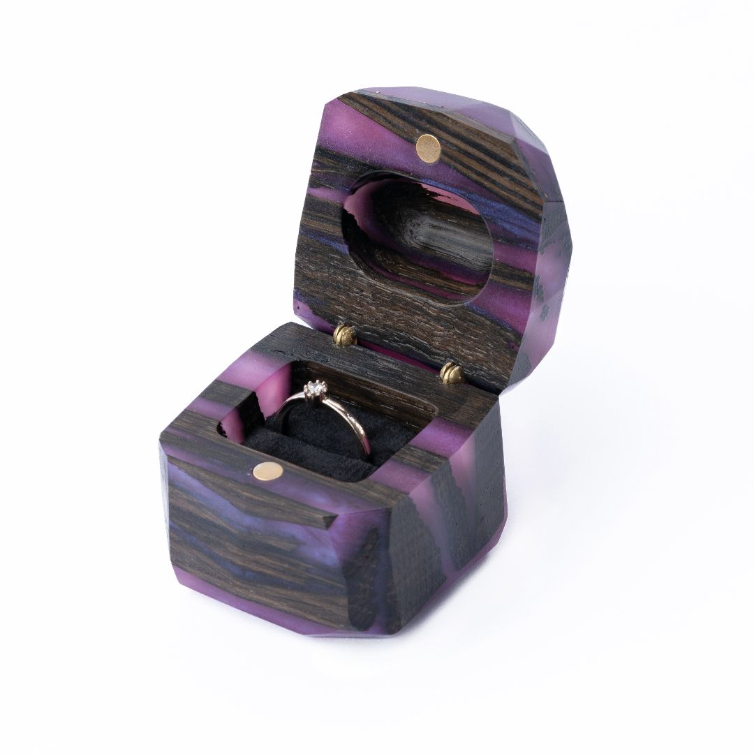 Three-quarter view of the purple epoxy and bog oak wood proposal ring box with open lid